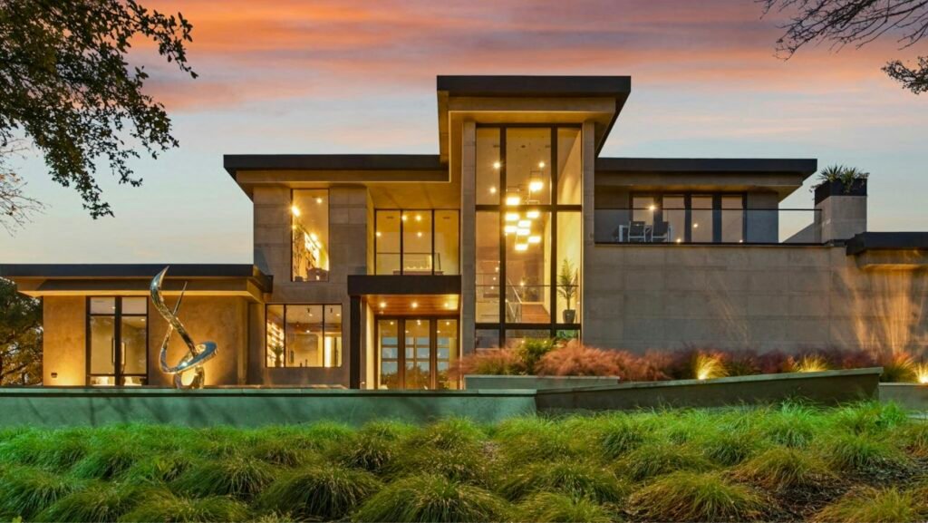 Modern coastal home exterior at dusk